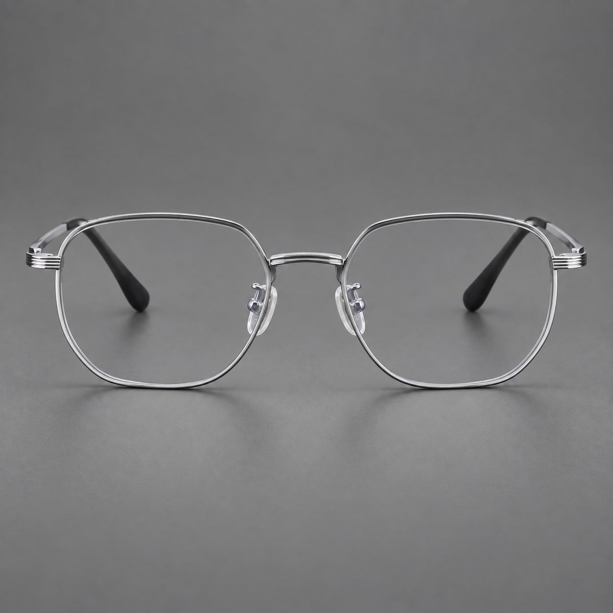 Geometric titanium glasses with flattened corners and a finely ridged bridge in Silver, front view