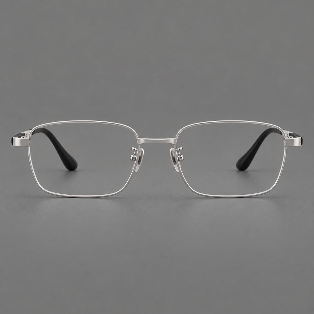 Slim rectangular titanium glasses with broad temples and contrasting dark inserts in Silver, front view