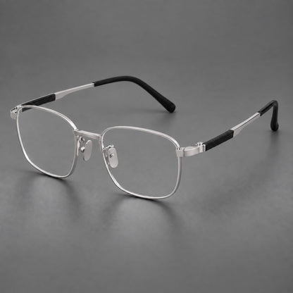 Slim rectangular titanium glasses with broad temples and contrasting dark inserts in Silver, three quarter view additional product view