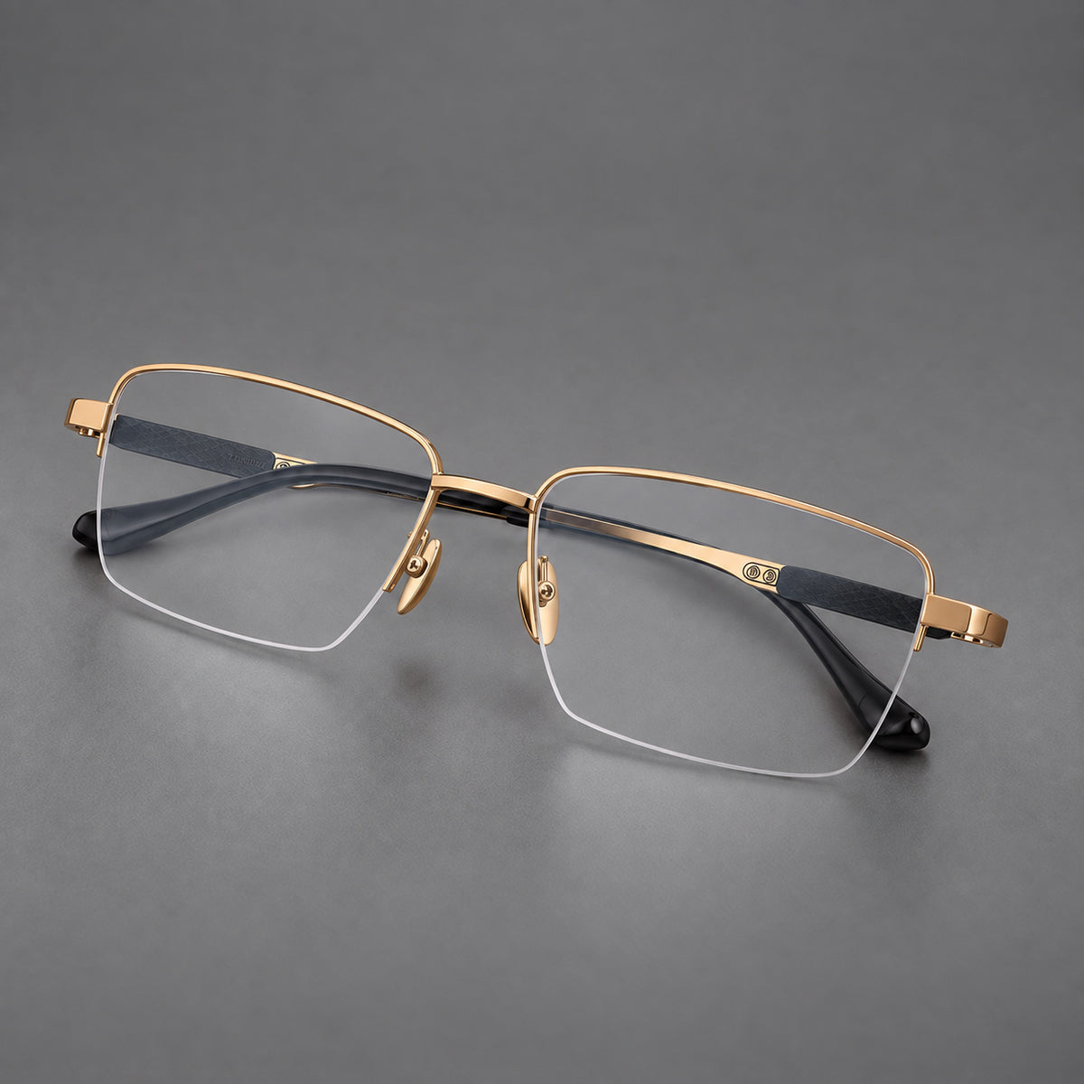 Wide half frame titanium glasses with rectangular lenses and textured temples in Gold, three quarter view