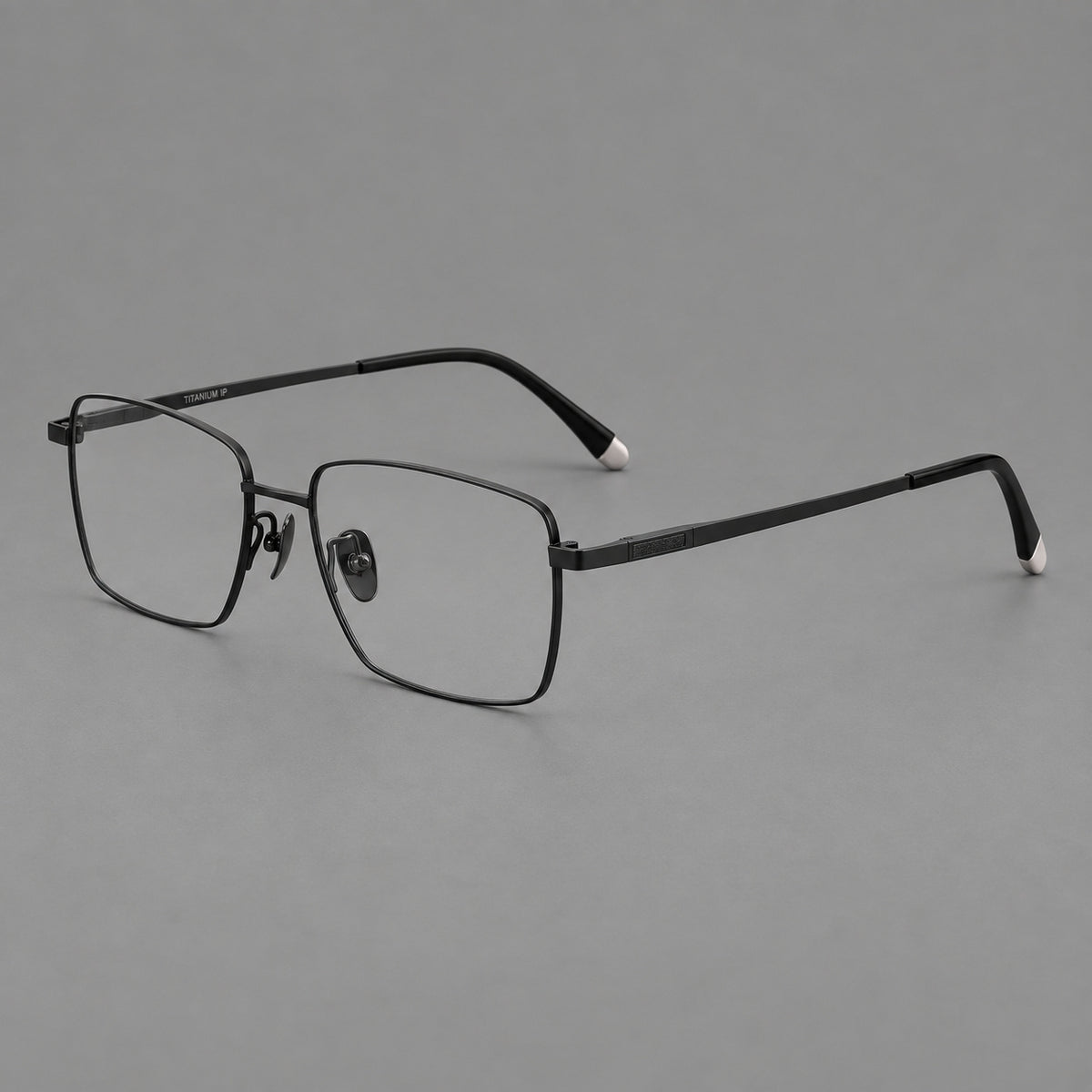 Clean rectangular titanium glasses with inset temple details and pale end accents in Black, three quarter view