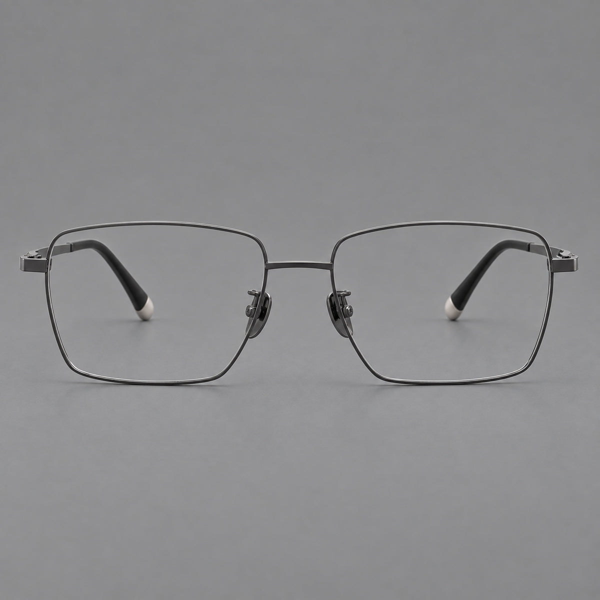 Clean rectangular titanium glasses with inset temple details and pale end accents in Gunmetal, front view
