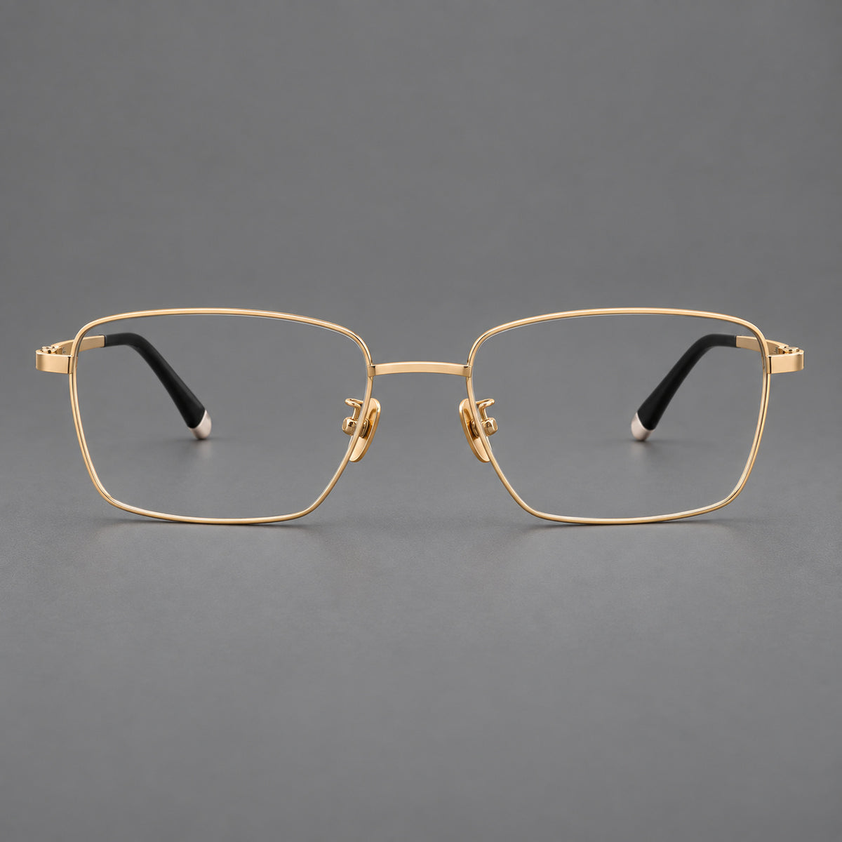 Clean rectangular titanium glasses with inset temple details and pale end accents in Gold, front view