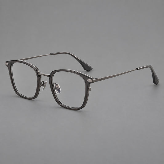 Bold square titanium glasses with a separate bridge and long metal corner accents in Gunmetal, three quarter view