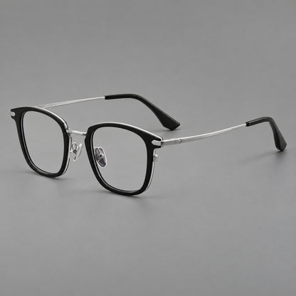Bold square titanium glasses with a separate bridge and long metal corner accents in Black and Silver, three quarter view lens detail