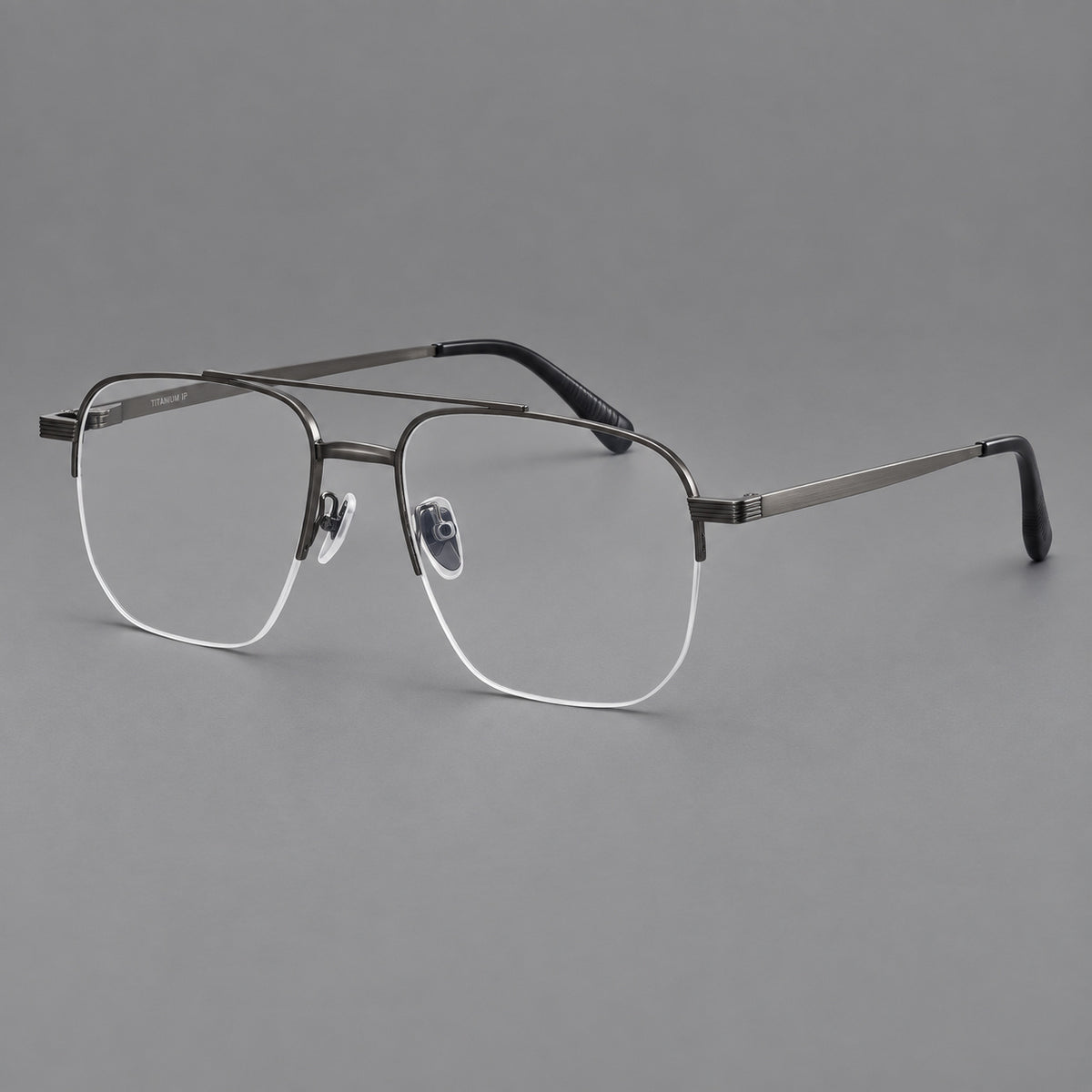 Angular aviator titanium glasses with a double bridge and an open lower rim in Gunmetal, three quarter view