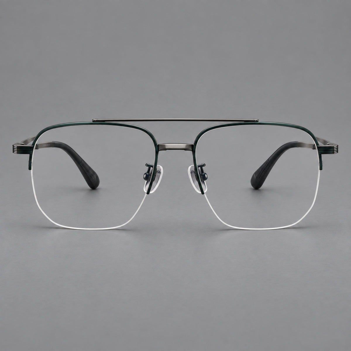 Angular aviator titanium glasses with a double bridge and an open lower rim in Dark Green and Gunmetal, front view