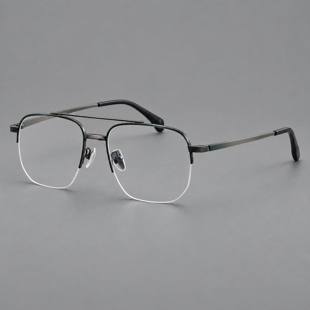 Angular aviator titanium glasses with a double bridge and an open lower rim in Dark Green and Gunmetal, three quarter view
