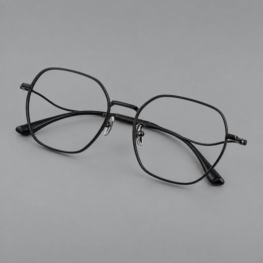 Geometric titanium glasses with engraved rim edges and curved temple joins in Black, three quarter view