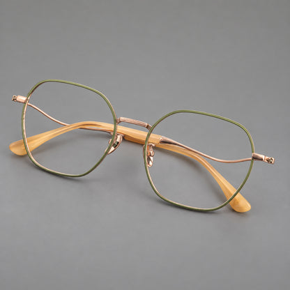 Geometric titanium glasses with engraved rim edges and curved temple joins in Green and Rose Gold, three quarter view lens detail