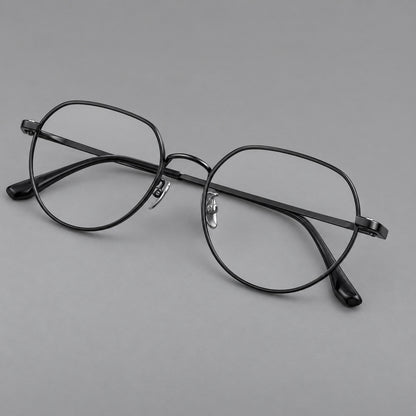 Classic panto titanium glasses with a curved bridge and slim straight temples in Black, three quarter view