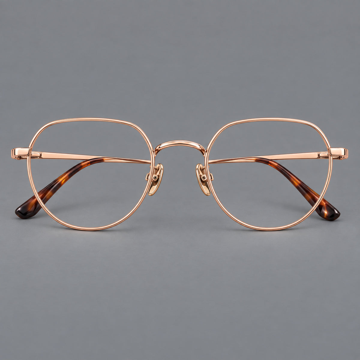 Classic panto titanium glasses with a curved bridge and slim straight temples in Rose Gold, front view