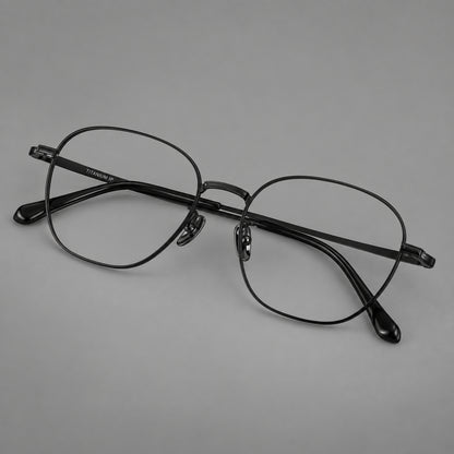Retro panto titanium glasses with stepped corners and finely engraved temples in Black, three quarter view