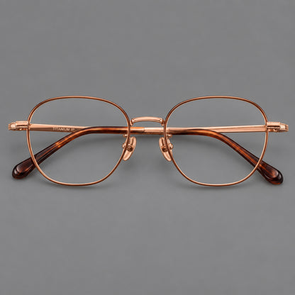 Retro panto titanium glasses with stepped corners and finely engraved temples in Brown and Rose Gold, front view frame detail