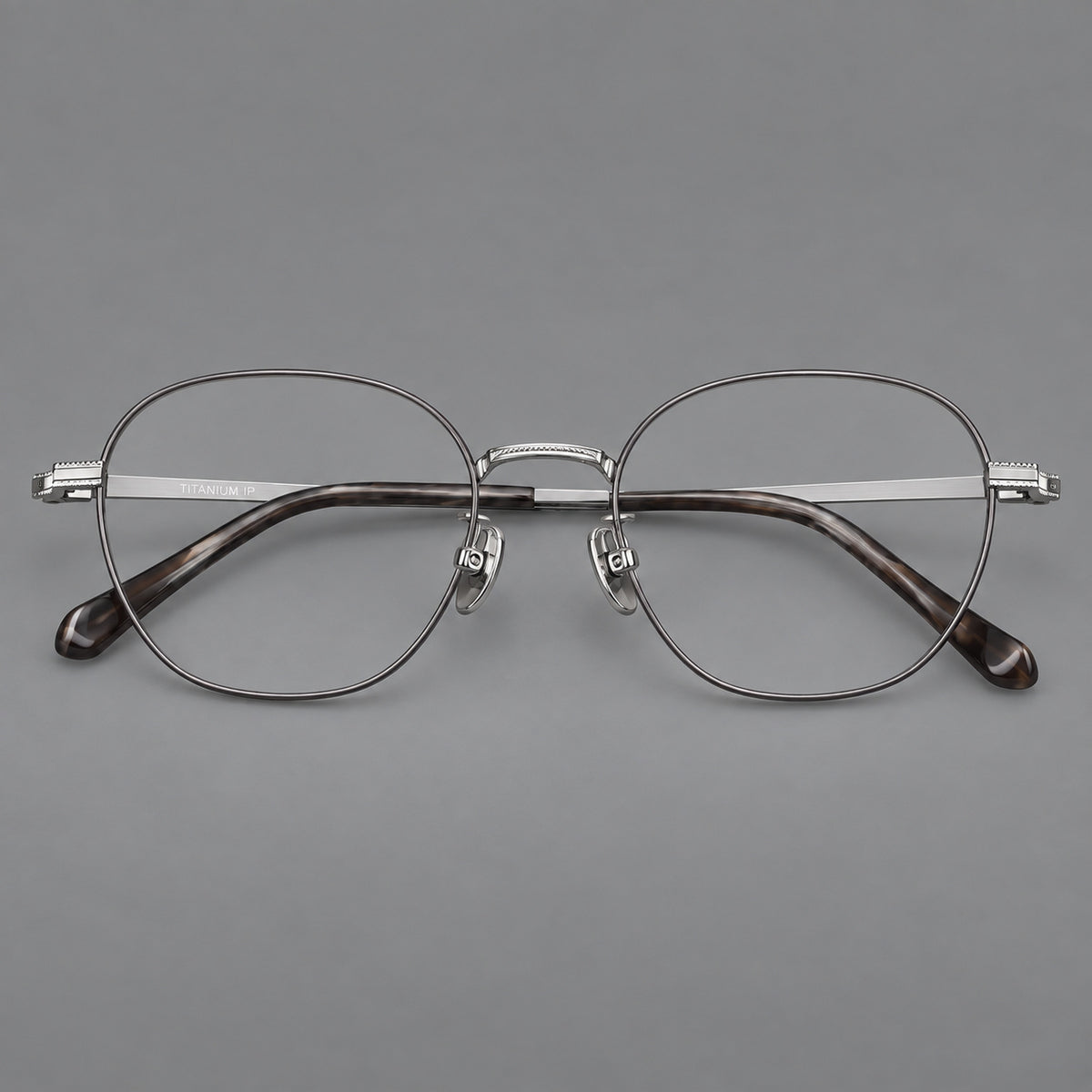 Retro panto titanium glasses with stepped corners and finely engraved temples in Grey and Silver, front view