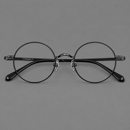 Compact circular titanium glasses with a curved bridge and wavy engraved temples in Black, front view side view