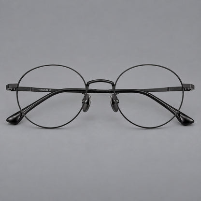Classic circular titanium glasses with a raised bridge and lined temple accents in Black, front view side view