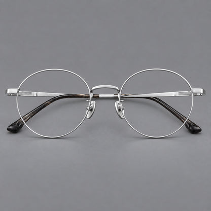 Classic circular titanium glasses with a raised bridge and lined temple accents in Silver, front view temple detail