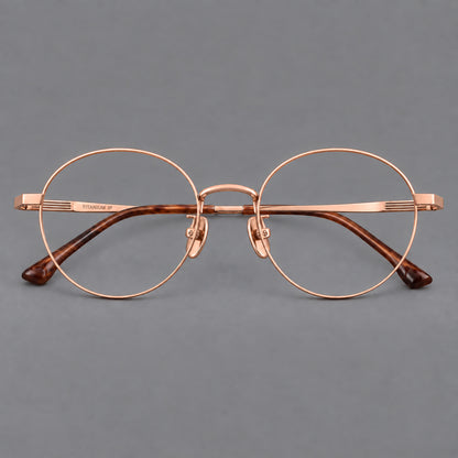 Classic circular titanium glasses with a raised bridge and lined temple accents in Rose Gold, front view additional product view