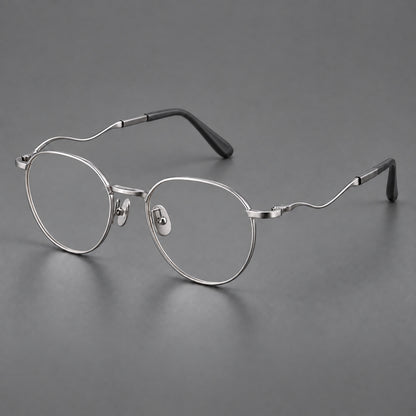 Rounded titanium glasses with a short bridge and distinctive wavy metal temples in Silver, three quarter view additional product view