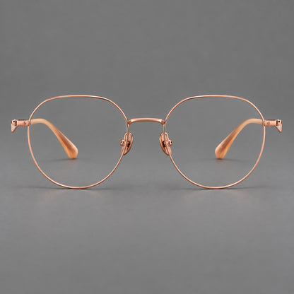 Rounded titanium glasses with a short bridge and distinctive wavy metal temples in Rose Gold, front view additional product view