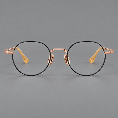 Small panto titanium glasses with an angular bridge and recessed temple details in Black and Rose Gold, front view frame detail