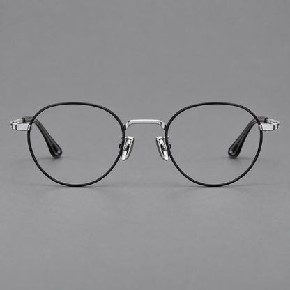 Small panto titanium glasses with an angular bridge and recessed temple details in Black and Silver, front view temple detail