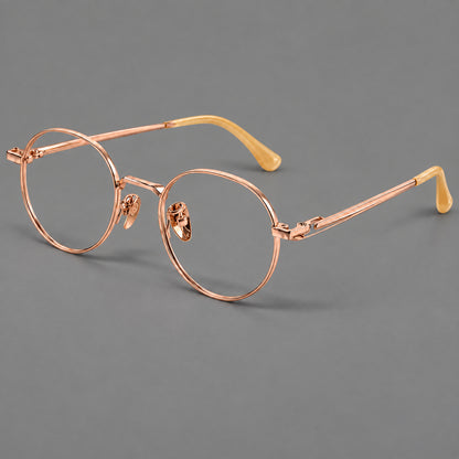 Small panto titanium glasses with an angular bridge and recessed temple details in Rose Gold, three quarter view additional product view