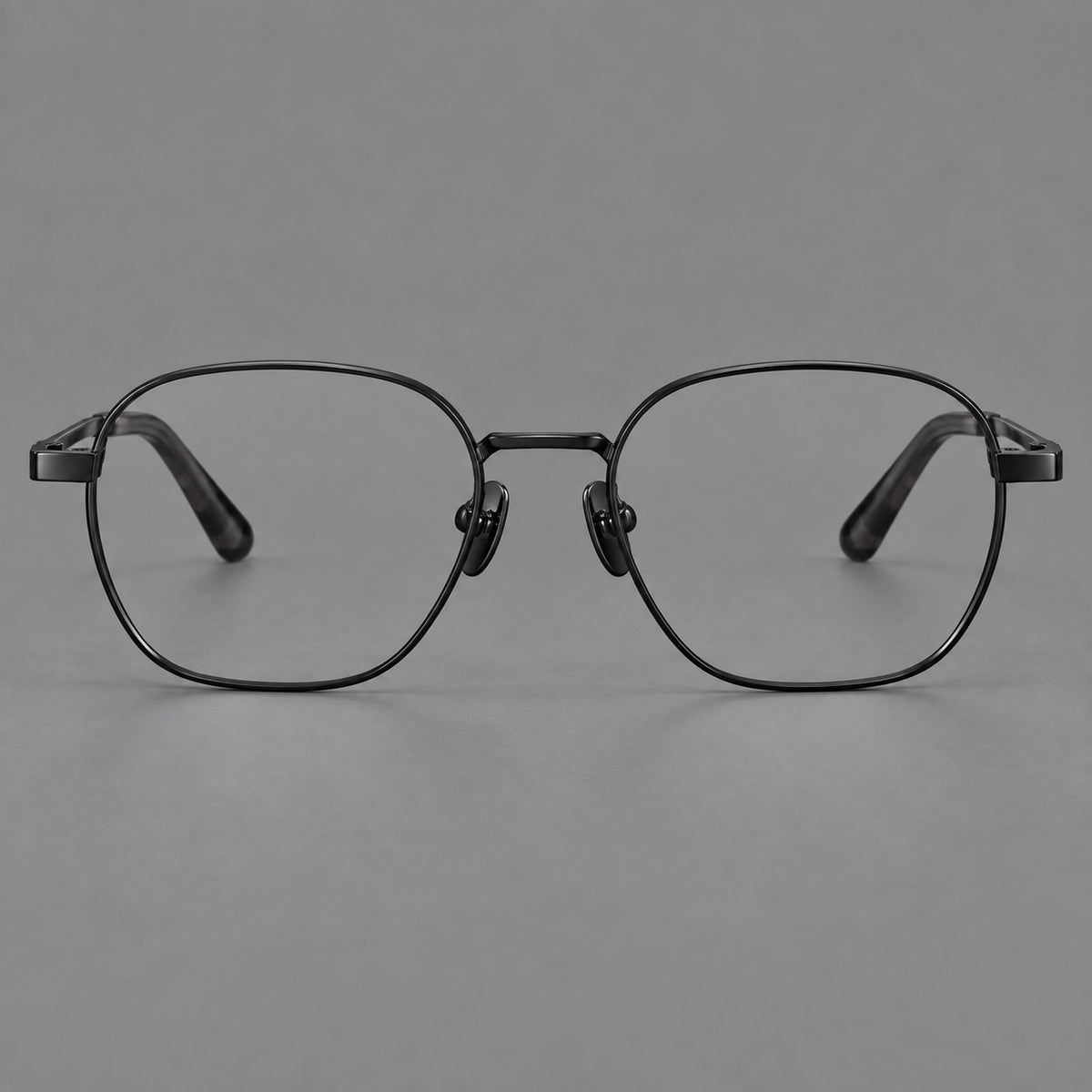 Rounded panto titanium glasses with an angular bridge and broad flat temples in Black, front view