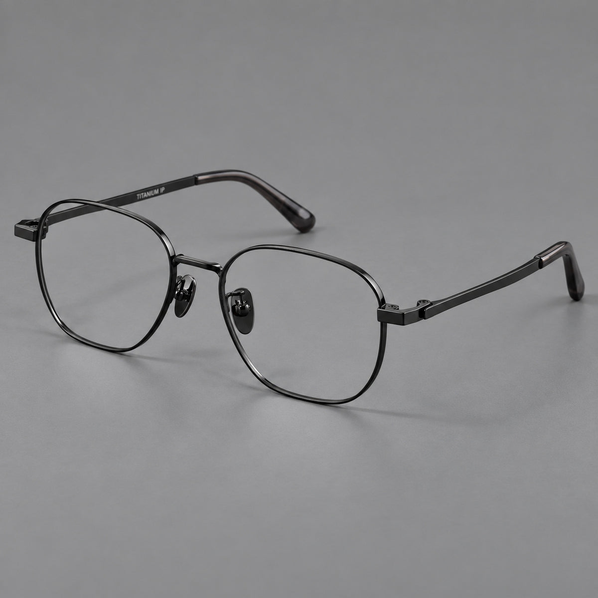 Rounded panto titanium glasses with an angular bridge and broad flat temples in Black, three quarter view