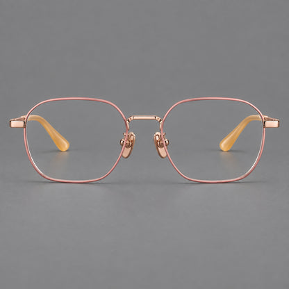 Rounded panto titanium glasses with an angular bridge and broad flat temples in Pink and Rose Gold, front view frame detail