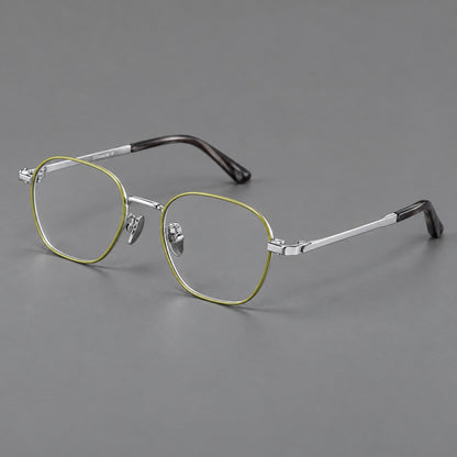 Rounded panto titanium glasses with an angular bridge and broad flat temples in Green and Silver, three quarter view lens detail