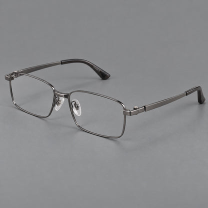 Wide rectangular titanium glasses with a broad bridge and rounded hinge caps in Gunmetal, three quarter view front view