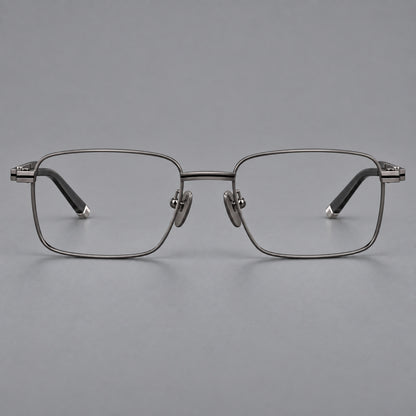 Rectangular titanium glasses with inset corner lines and metal capped temple tips in Gunmetal, front view frame detail