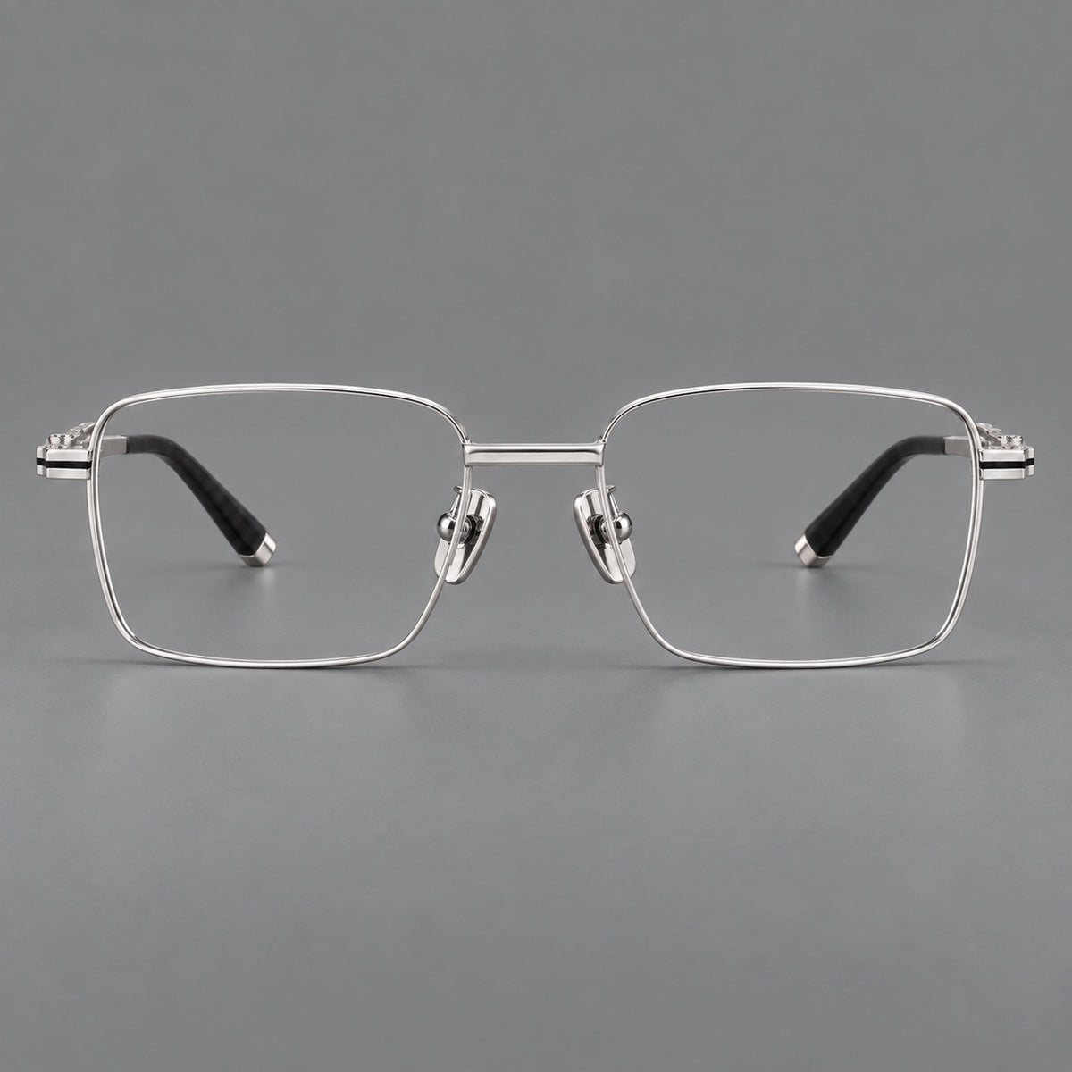 Rectangular titanium glasses with inset corner lines and metal capped temple tips in Silver, front view