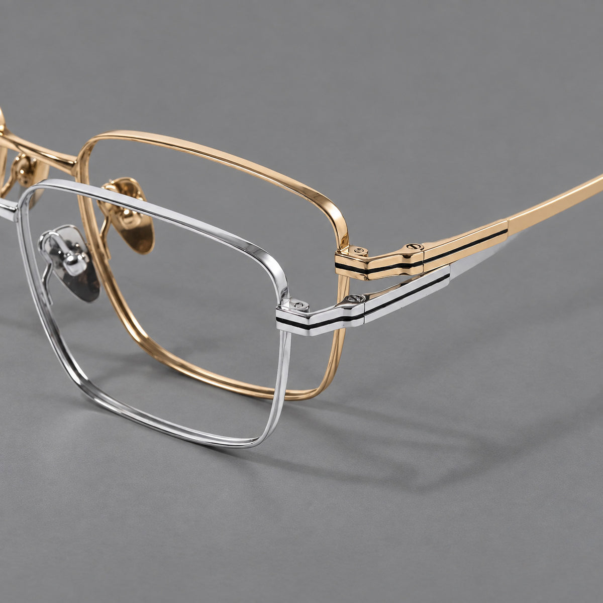 Rectangular titanium glasses with inset corner lines and metal capped temple tips, frame details