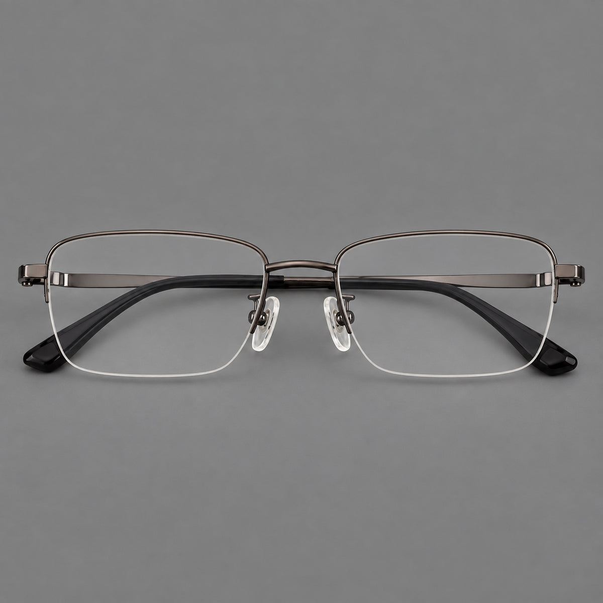 Half frame titanium glasses with rectangular lenses and rounded hinge details in Gunmetal, front view