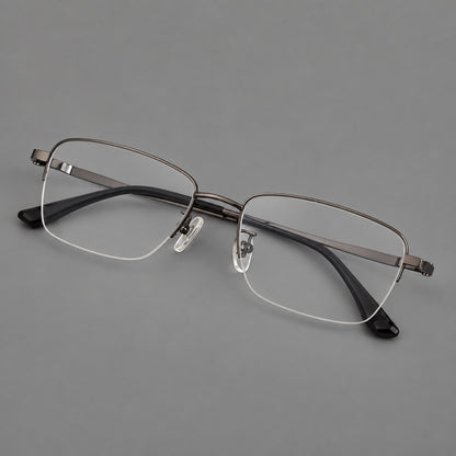 Half frame titanium glasses with rectangular lenses and rounded hinge details in Gunmetal, three quarter view front view