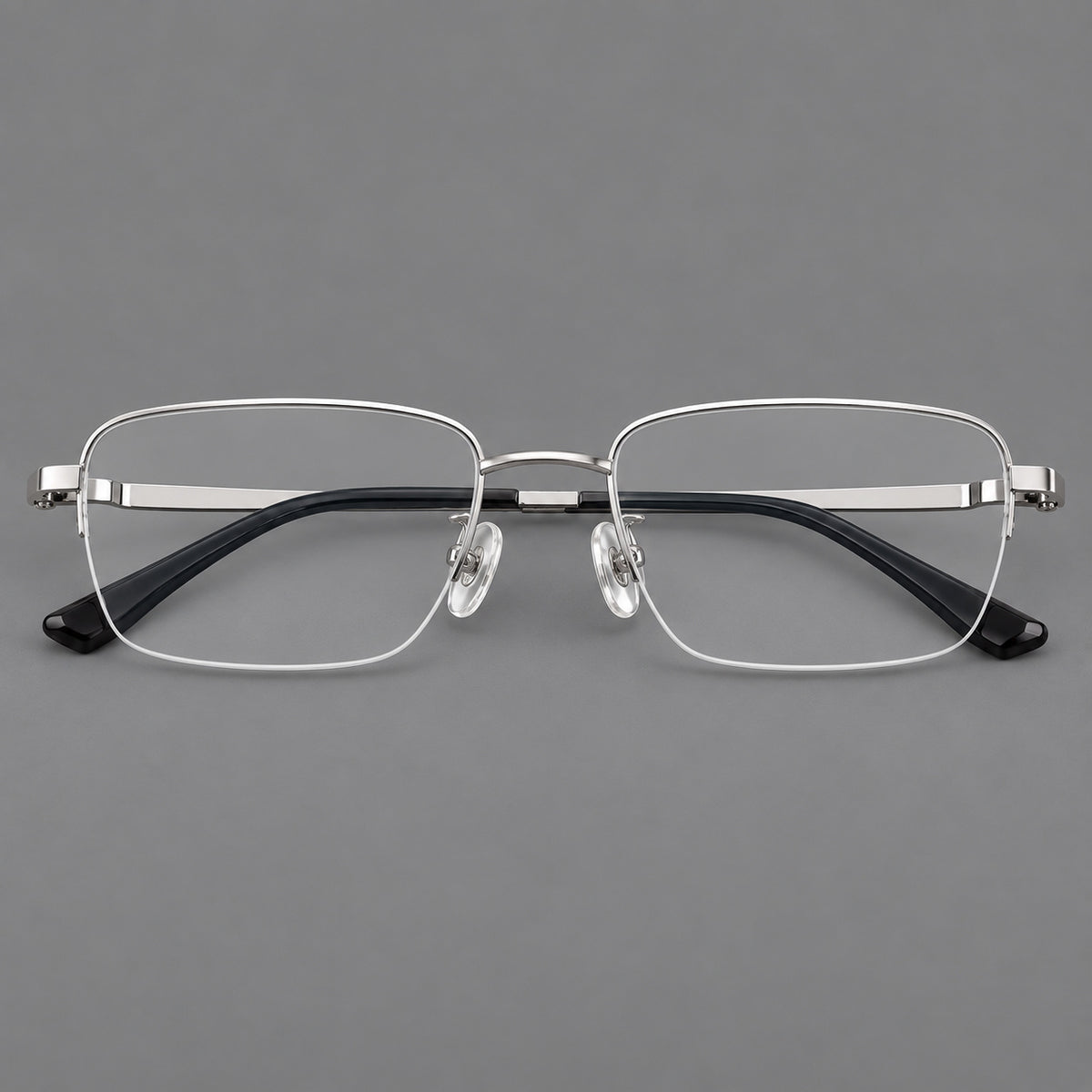 Half frame titanium glasses with rectangular lenses and rounded hinge details in Silver, front view