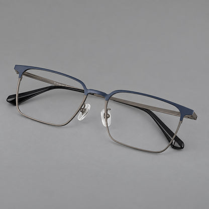 Bold rectangular titanium glasses with strong upper corners and flat metal temples in Blue and Gunmetal, three quarter view front view