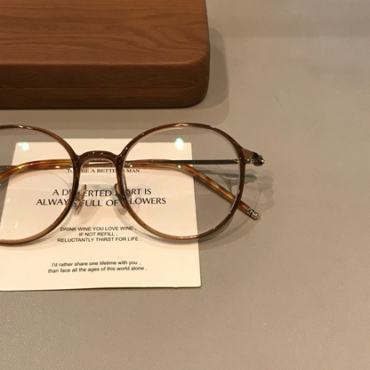 Round Eyeglass Frames with Thin Rims, Transparent Gray or Cool Tea Bro front view