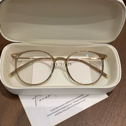 Round Eyeglass Frames with a Defined Browline, Cool Tea Brown or Oolon lens detail