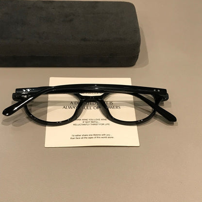 Retro Round Eyeglass Frames with Thick Rims and a Raised Bridge, Black front view