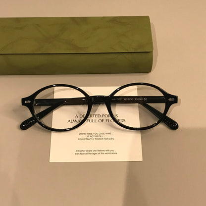 Retro Oval Eyeglass Frames with a Low-Profile Front, Black or Tortoise front view
