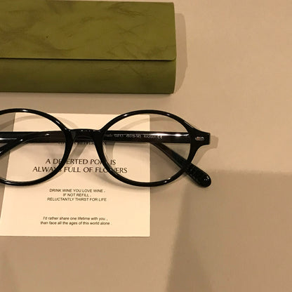 Retro Oval Eyeglass Frames with a Low-Profile Front, Black or Tortoise frame detail