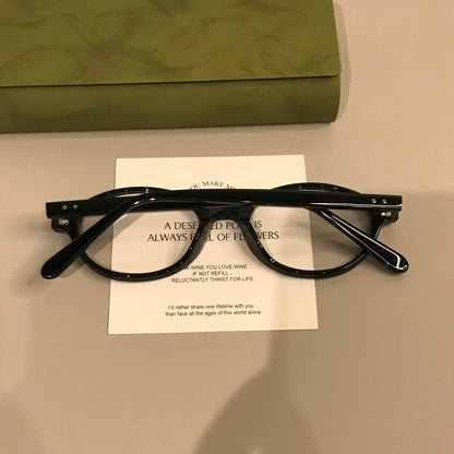 Retro Oval Eyeglass Frames with a Low-Profile Front, Black or Tortoise lens detail