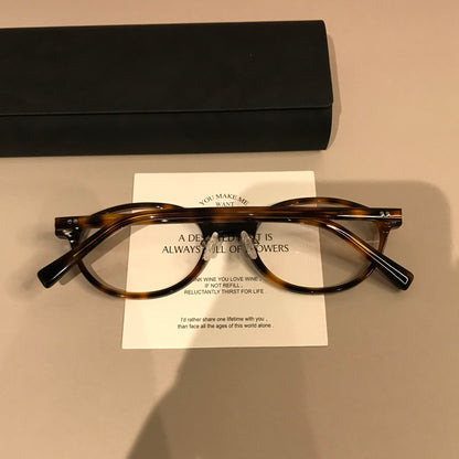 Wide Oval Eyeglass Frames with Thick Rims, Tortoiseshell temple detail