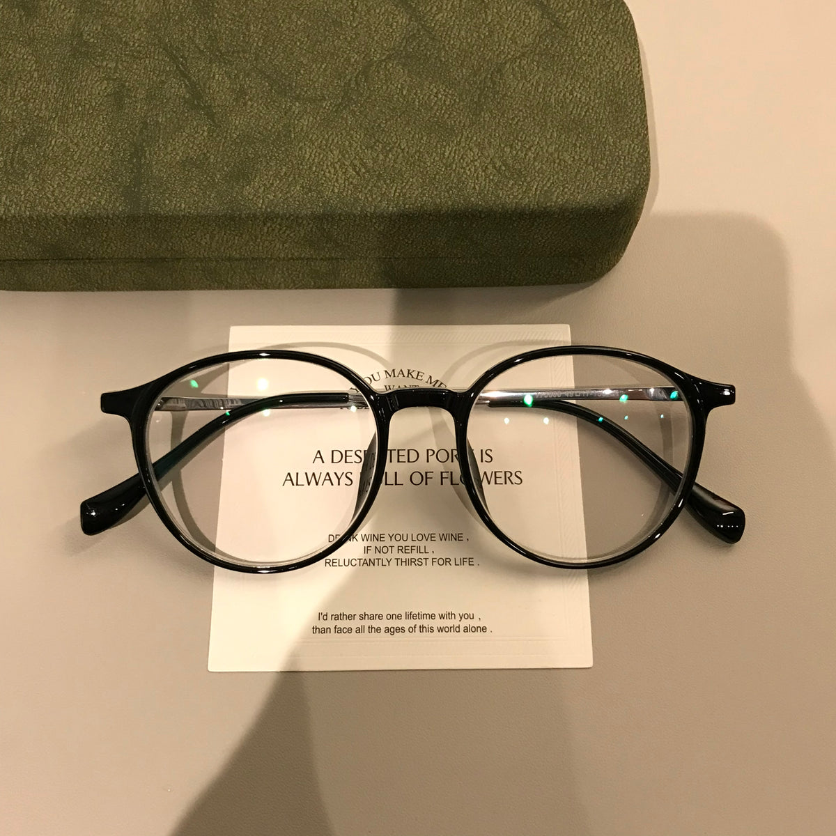 Round Eyeglass Frames with a Keyhole-Style Bridge, Black or Transparen lens detail