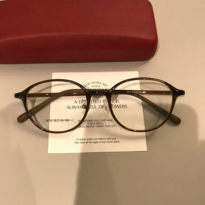 Round Eyeglass Frames with Broad Temples and Corner Studs, Black, Tort temple detail