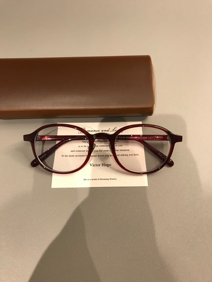 Oval Eyeglass Frames with a Thick Upper Rim, Black, Burgundy or Tortoi lens detail